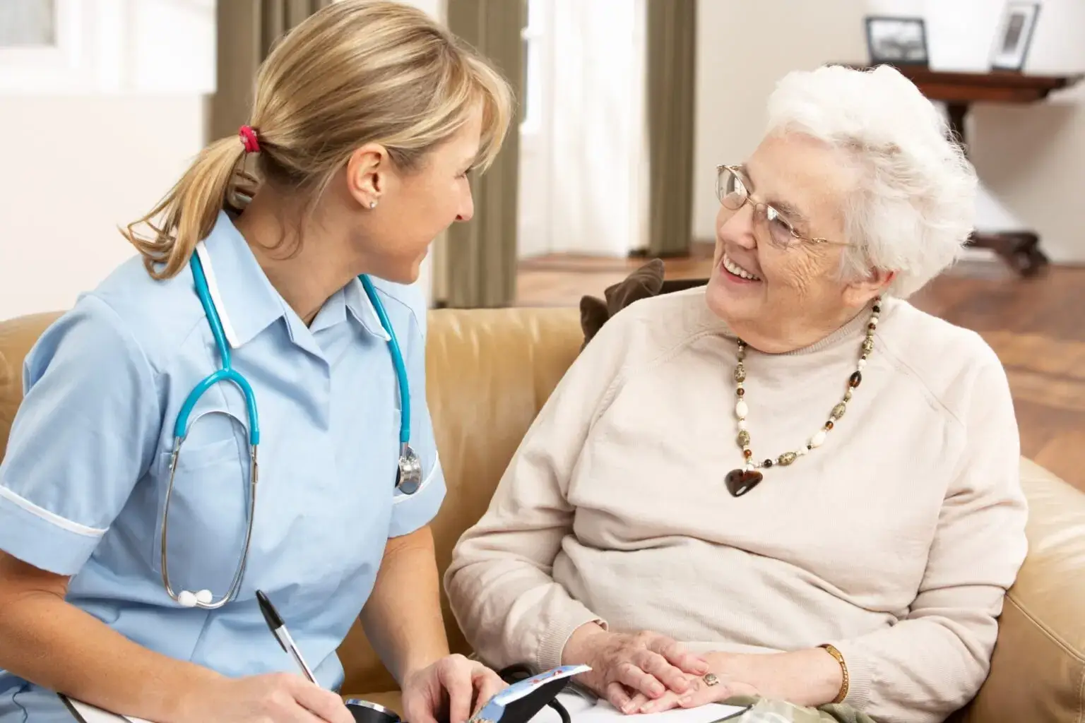 female care home residents chatting about a database for care homes.